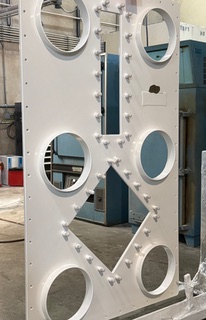 Coated glovebox wall with circular ports and mounting details