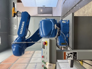 Blue Yaskawa robot in the Fisher Company workshop